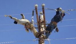 electrical linemen on pole